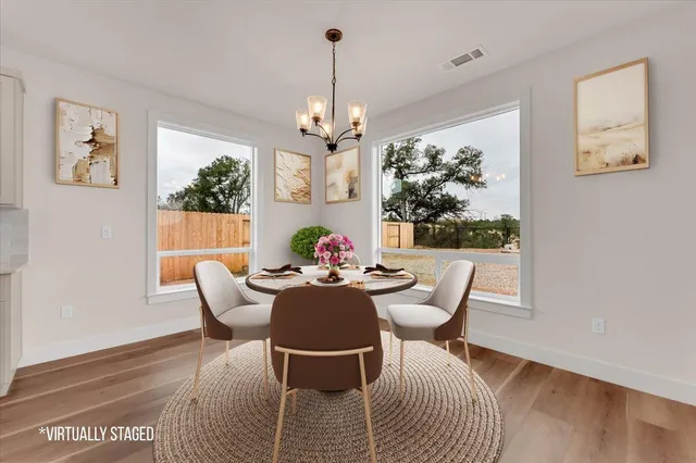 a dining room with furniture and window
