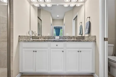 an aerial view of a house with garden space and ocean view