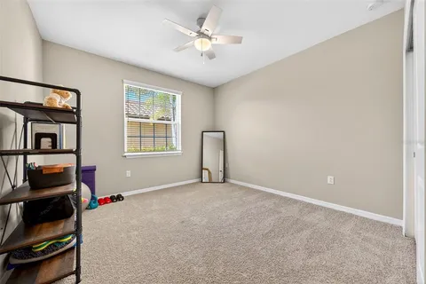 an aerial view of a house with a big yard