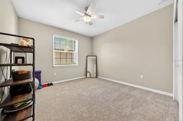 an aerial view of a house with a big yard