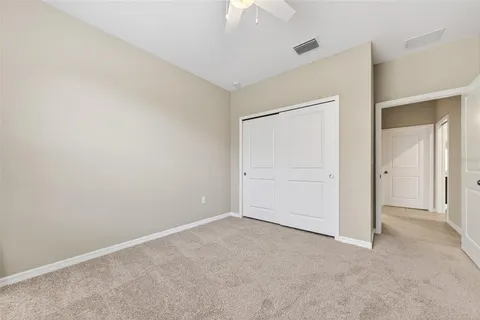 an aerial view of a house with garden space and a street view