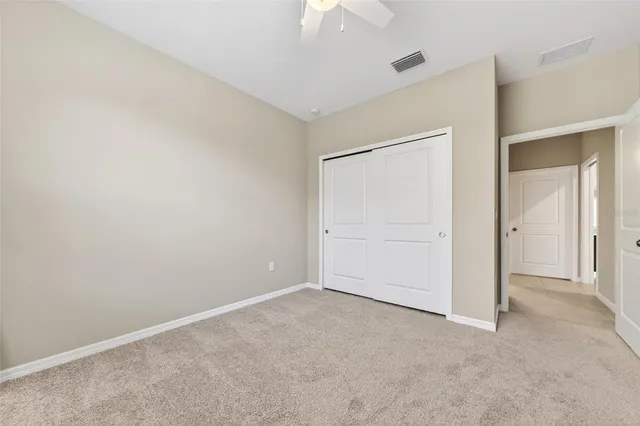 an aerial view of a house with garden space and a street view