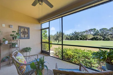 a swimming pool with outdoor seating