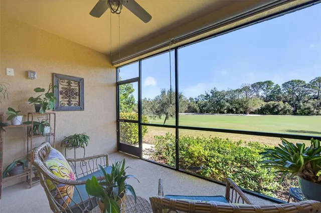 a swimming pool with outdoor seating