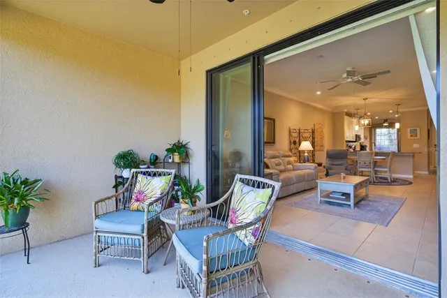 a sign of golf club on a wall under a tree