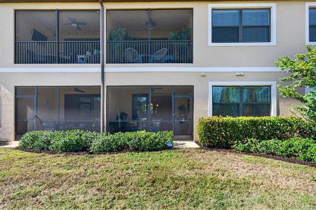 an aerial view of a city with lots of residential buildings and lake view