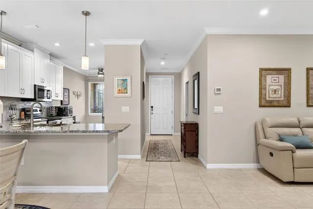 a kitchen with stainless steel appliances granite countertop a stove and a refrigerator