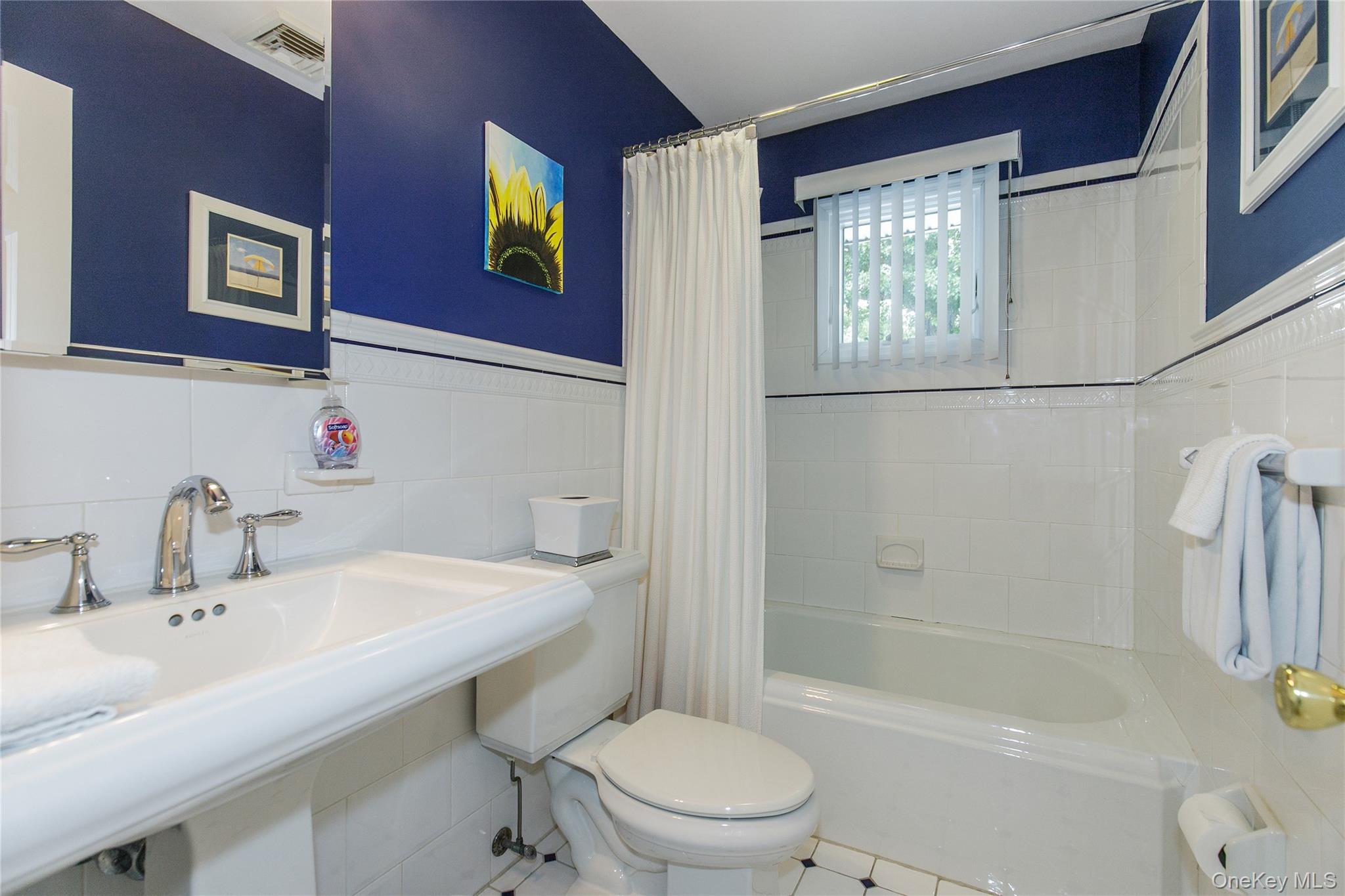 5 Searington Drive Syosset, NY 11791 - Photo 15 of 34 a bathroom with a sink toilet and shower