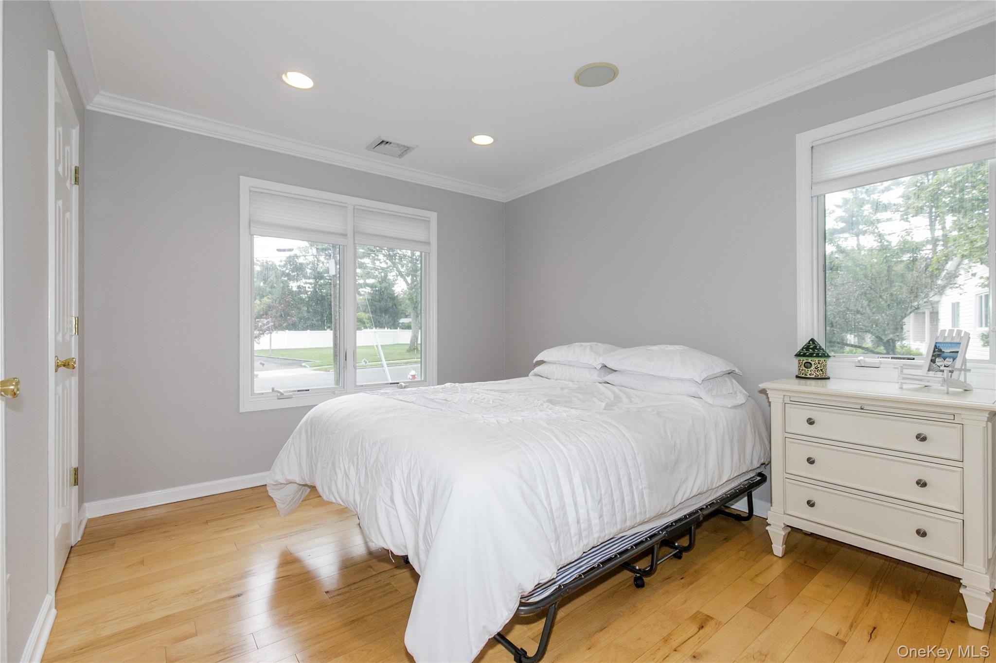 5 Searington Drive Syosset, NY 11791 - Photo 16 of 34 a bedroom with a bed and window
