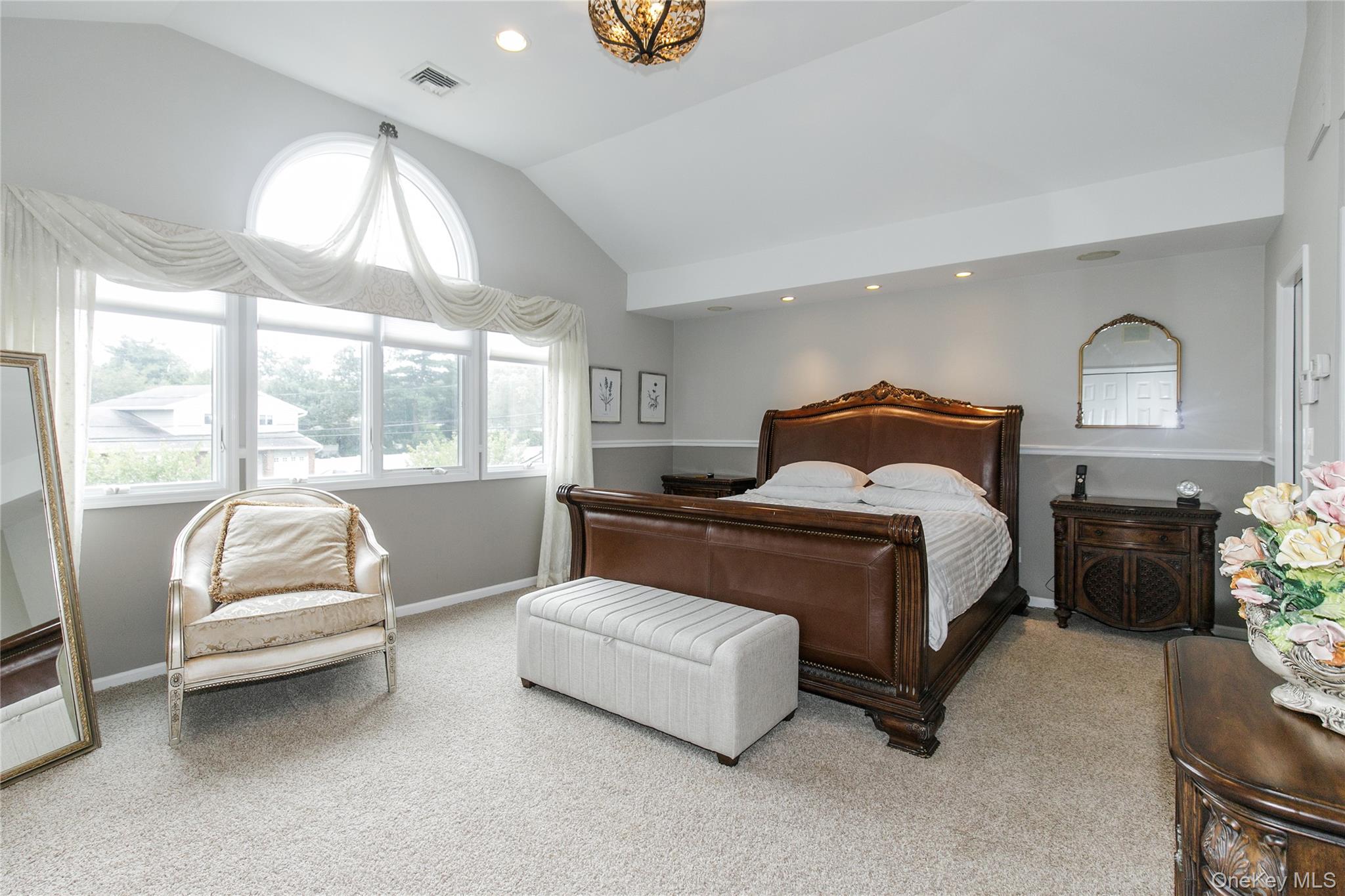 5 Searington Drive Syosset, NY 11791 - Photo 20 of 34 a bedroom with a bed and a couch