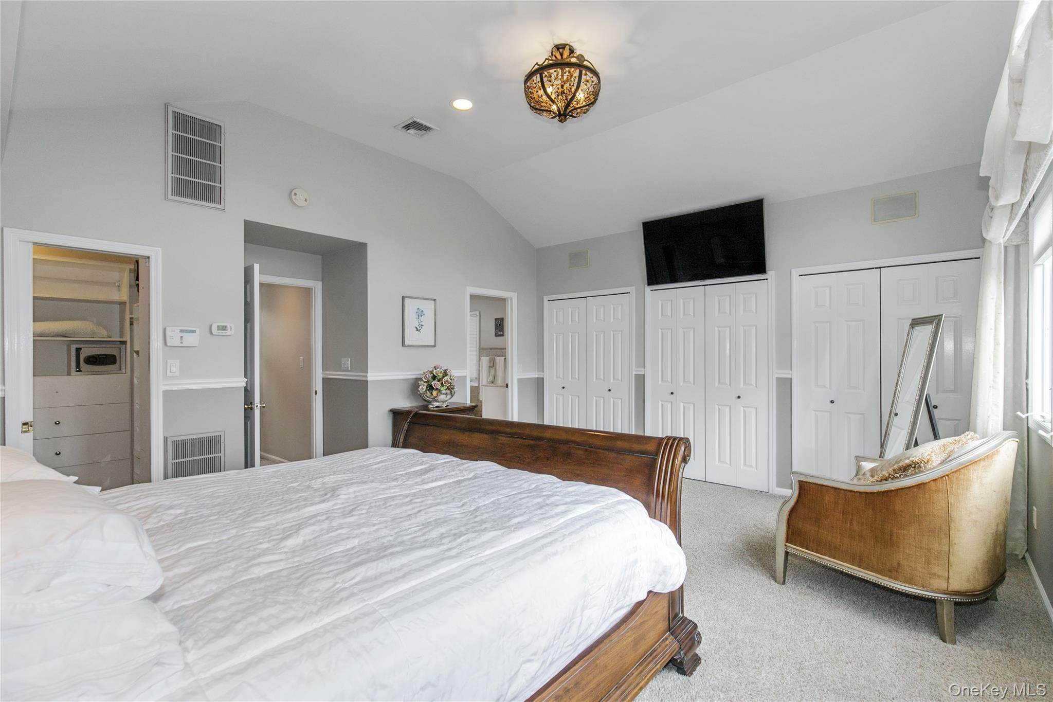 5 Searington Drive Syosset, NY 11791 - Photo 22 of 34 a bedroom with a bed and a couch