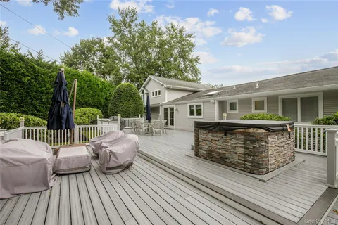 a view of a backyard with sitting area
