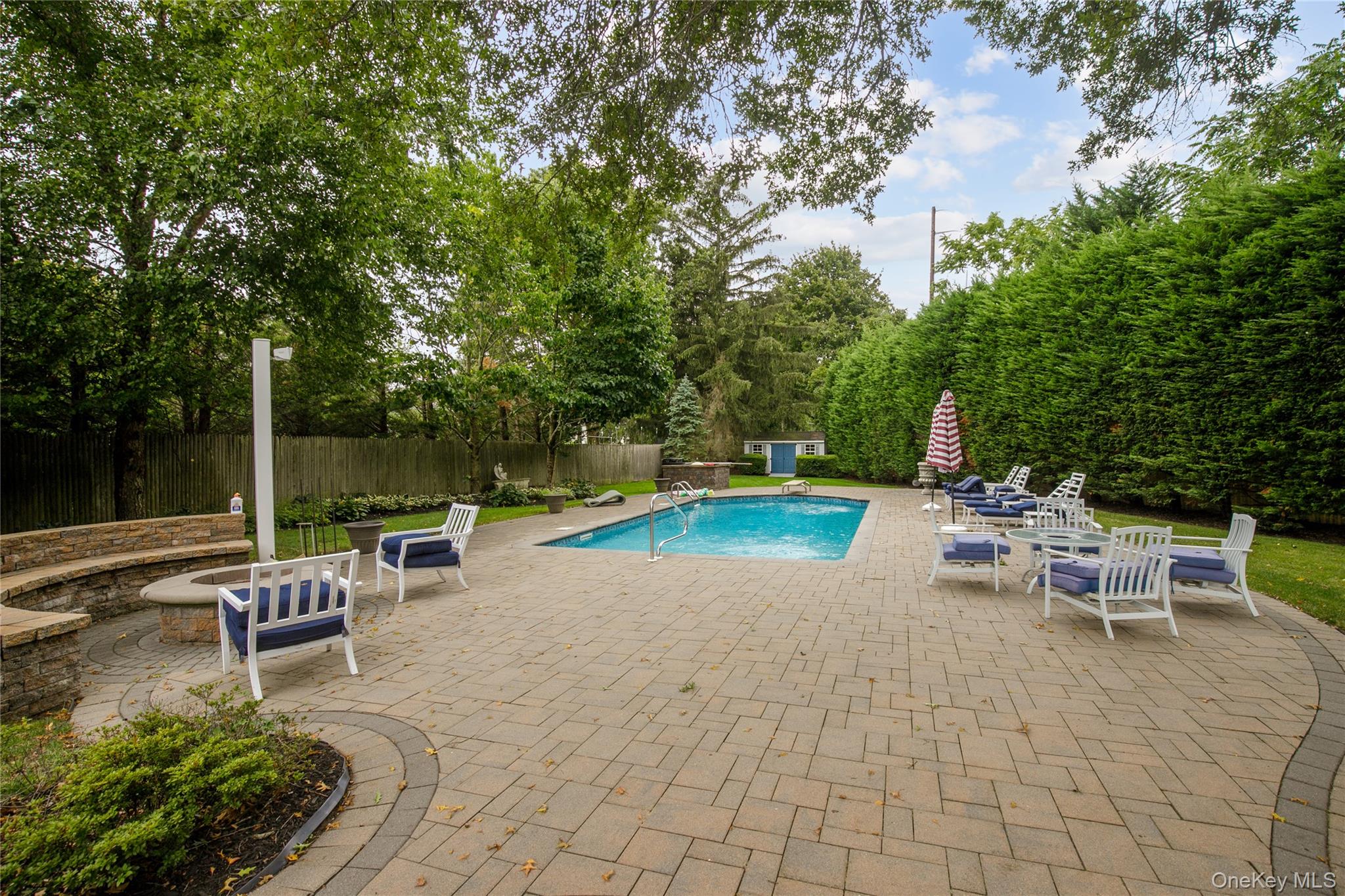 5 Searington Drive Syosset, NY 11791 - Photo 33 of 34 a view of a backyard with sitting area