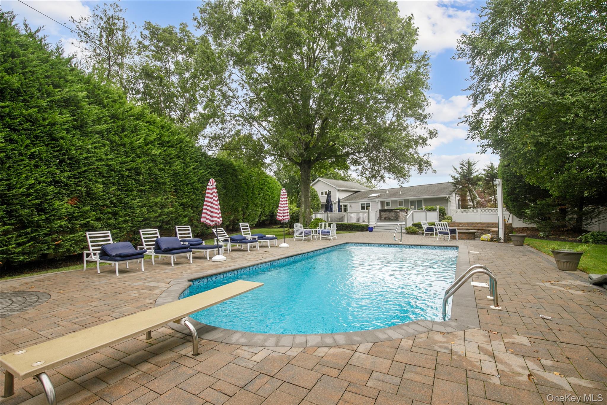 5 Searington Drive Syosset, NY 11791 - Photo 34 of 34 a view of swimming pool with sitting area and garden