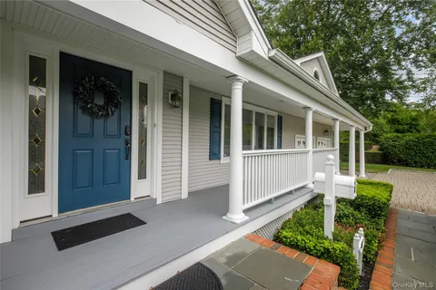a view of front door and yard