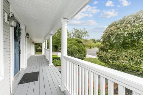 a view of balcony with wooden floor