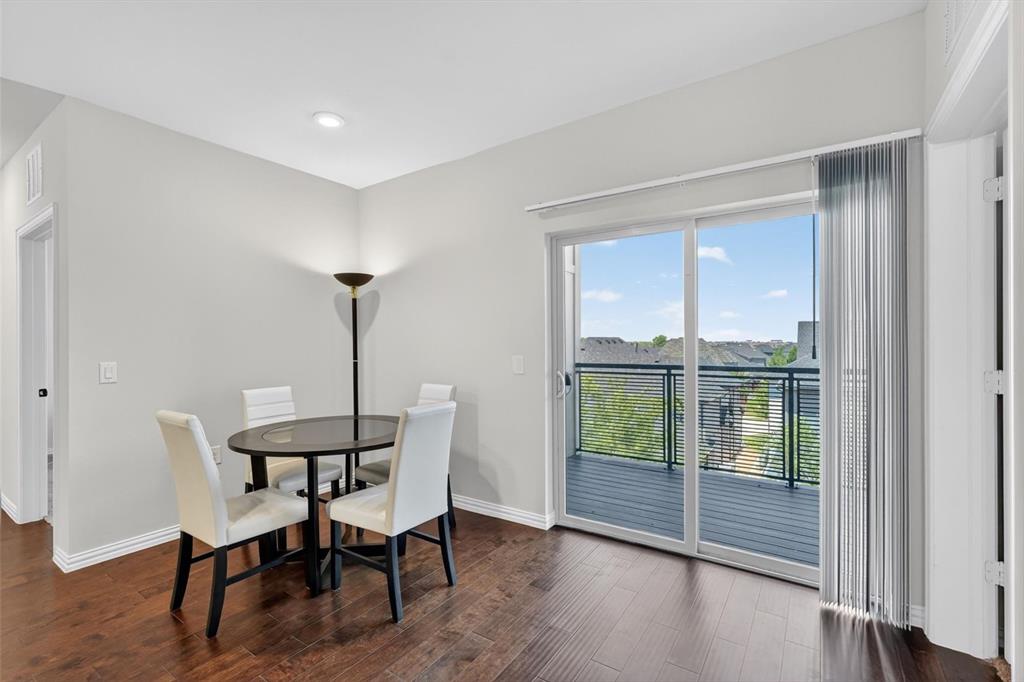 651 Watters Road, Unit 5305 Allen, TX 75013 - Photo 13 of 40 a view of a dining room with furniture window and wooden floor