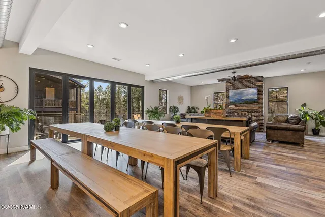 a view of a dining room with furniture window and wooden floor
