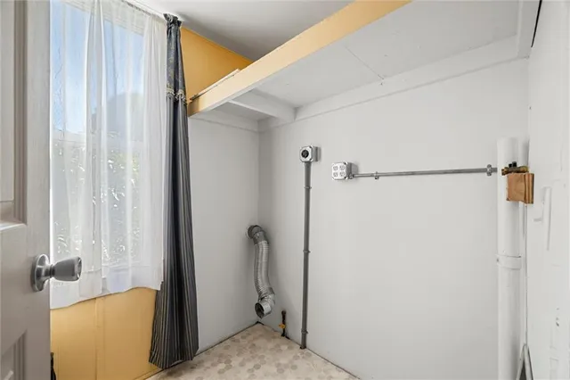 a view of a bathroom with a tub and shower