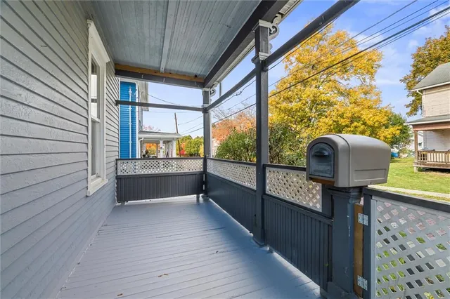 a view of a two chairs in the balcony
