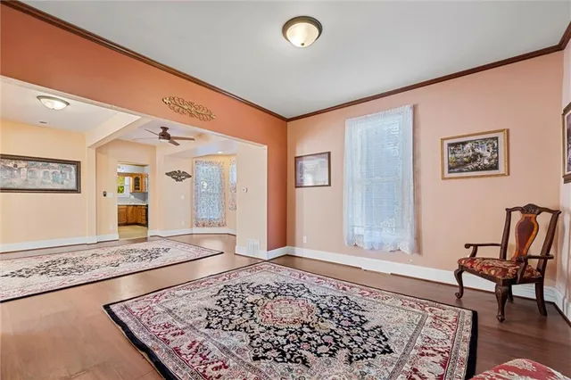 a view of a livingroom with furniture and windows