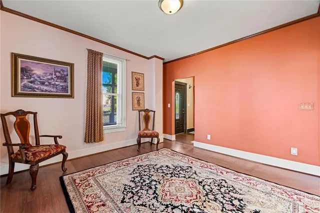 a living room with furniture and a rug