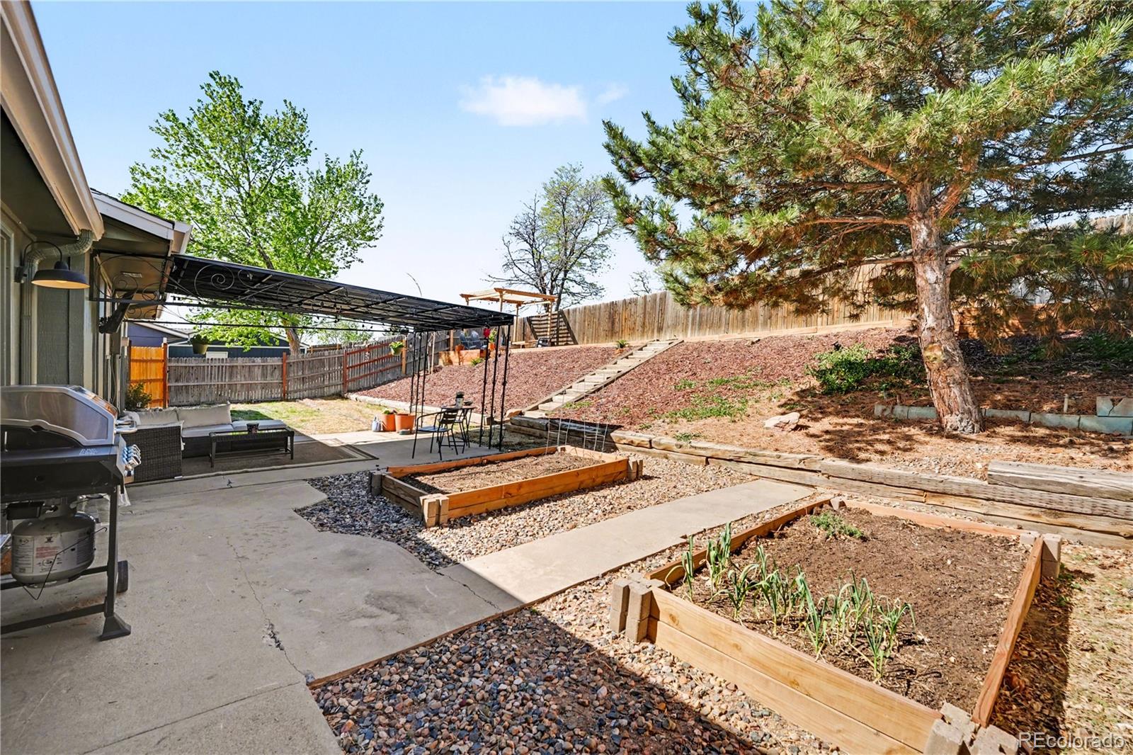 8207 High Street Denver, CO 80229 - Photo 21 of 31 a view of outdoor space with seating area