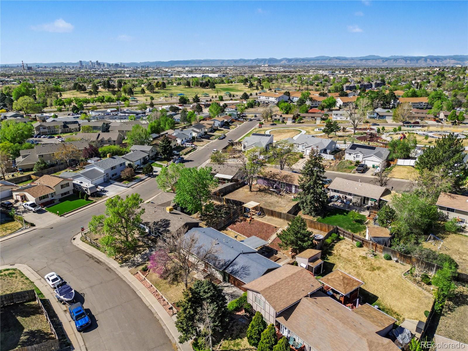8207 High Street Denver, CO 80229 - Photo 24 of 31 an aerial view of residential houses with outdoor space and trees