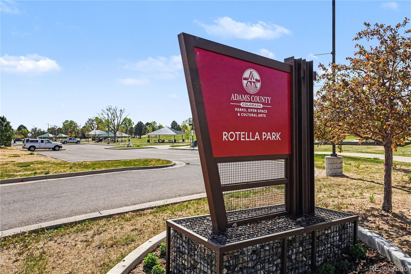 8207 High Street Denver, CO 80229 - Photo 29 of 31 a view of a street with benches in the background