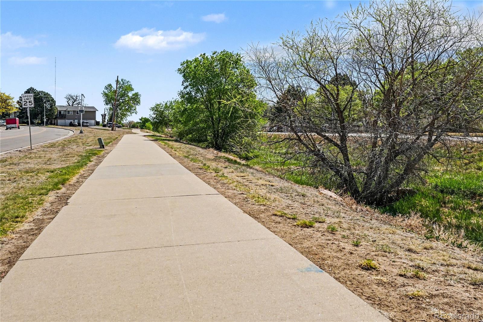 8207 High Street Denver, CO 80229 - Photo 30 of 31 a view of flowing water with large trees