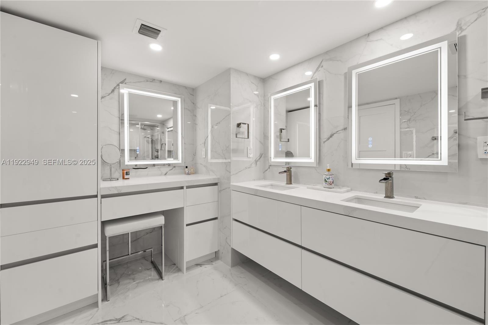 2801 Northeast 183rd Street, Unit 2116W Aventura, FL 33160 - Photo 11 of 23 a bathroom with a sink vanity and mirror