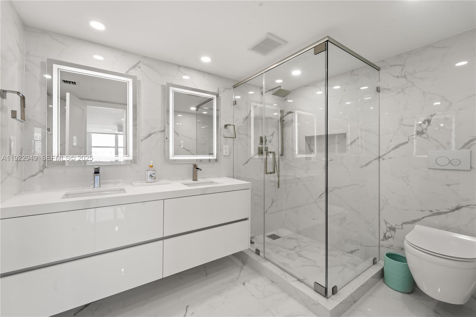 2801 Northeast 183rd Street, Unit 2116W Aventura, FL 33160 - Photo 12 of 23 a bathroom with a shower sink vanity and mirror