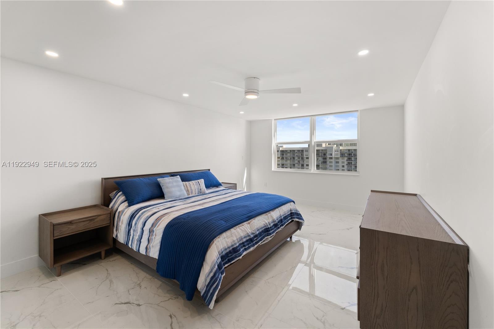 2801 Northeast 183rd Street, Unit 2116W Aventura, FL 33160 - Photo 10 of 23 a bed room with a bed and a window