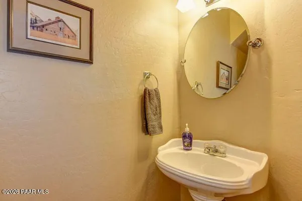 a bathroom with a sink and mirror