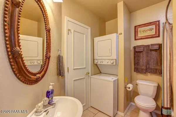 a bathroom with a toilet a sink and a mirror