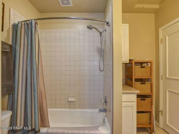 a bathroom with a shower and a tub
