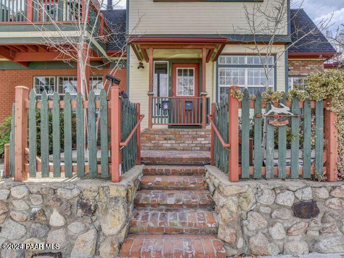 325 East E Union Prescott, AZ 86303 - Photo 2 of 13 a view of a brick house with large windows