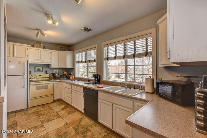325 East E Union Prescott, AZ 86303 - Photo 7 of 13 a kitchen with a sink stove and refrigerator