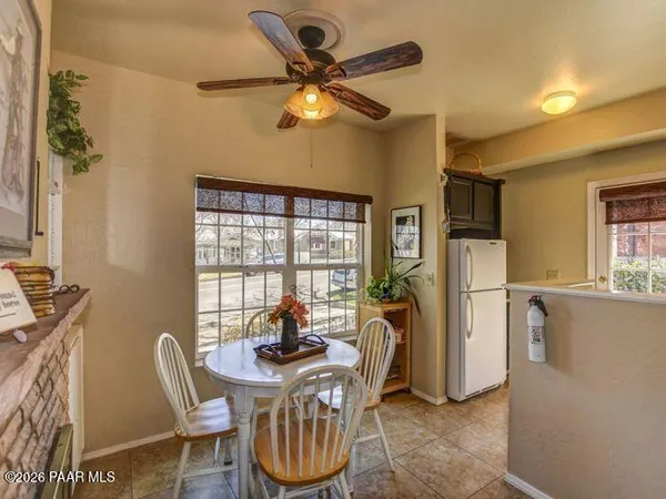a view of a dining room with furniture window and outside view