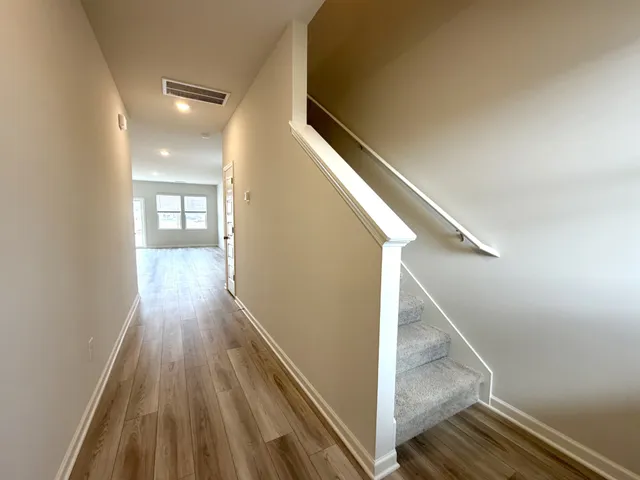 a view of entryway with wooden floor