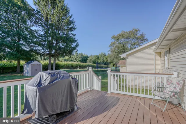 a view of a deck with couches and wooden floor