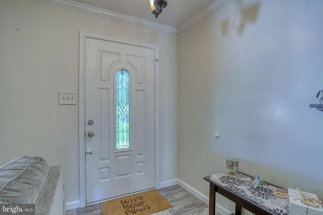 a view of an entryway with wooden floor
