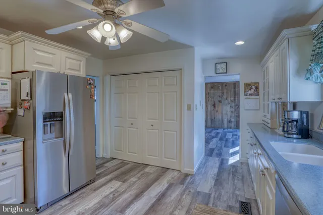 a view of a kitchen from the hallway