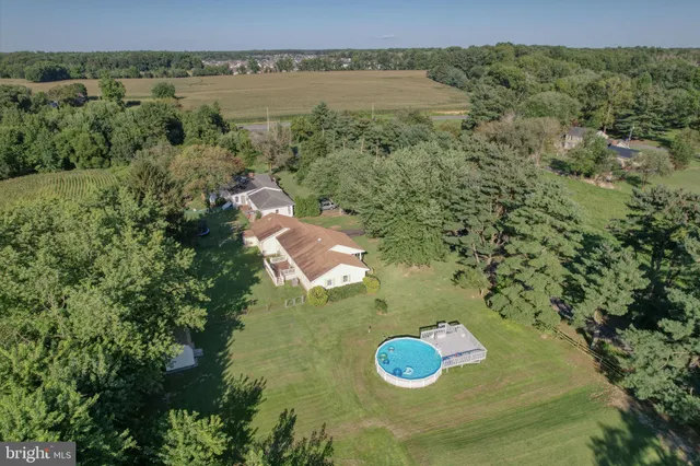 a view of a wooden house with a yard