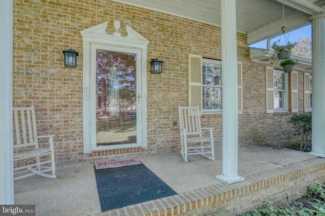 a front view of a house with a glass door