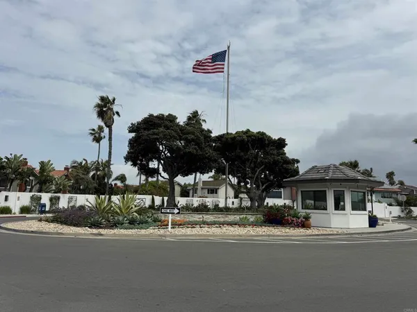 a front view of a house with a garden and street view