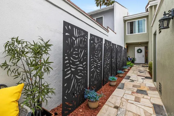 a view of a potted plants with wooden fence