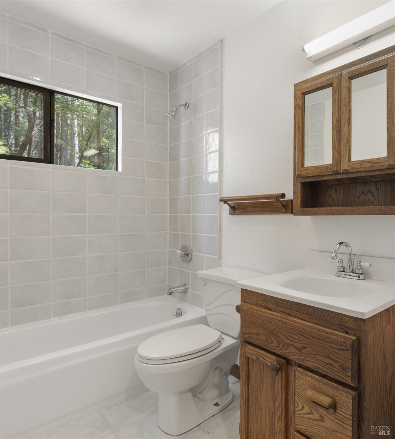 355 Chinquapin Lane The Sea Ranch, CA 95497 - Photo 16 of 31 a bathroom with a sink a toilet and shower