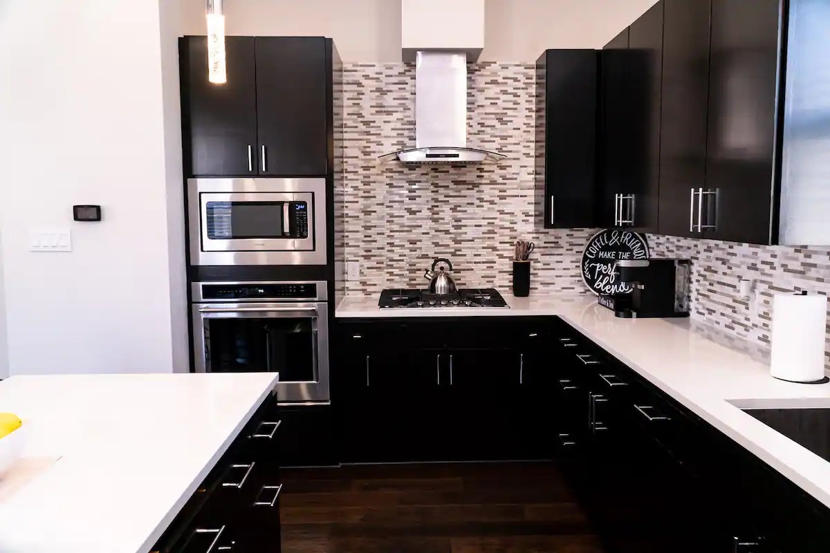 2105 Engelmohr Street, Unit A Houston, TX 77054 - Photo 5 of 16 a kitchen with stainless steel appliances a sink stove and microwave