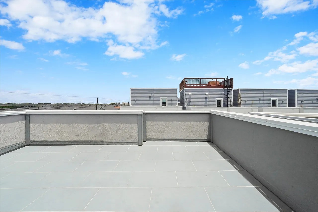 2105 Engelmohr Street, Unit A Houston, TX 77054 - Photo 7 of 16 a view of a kitchen with kitchen island a sink dishwasher and a stove